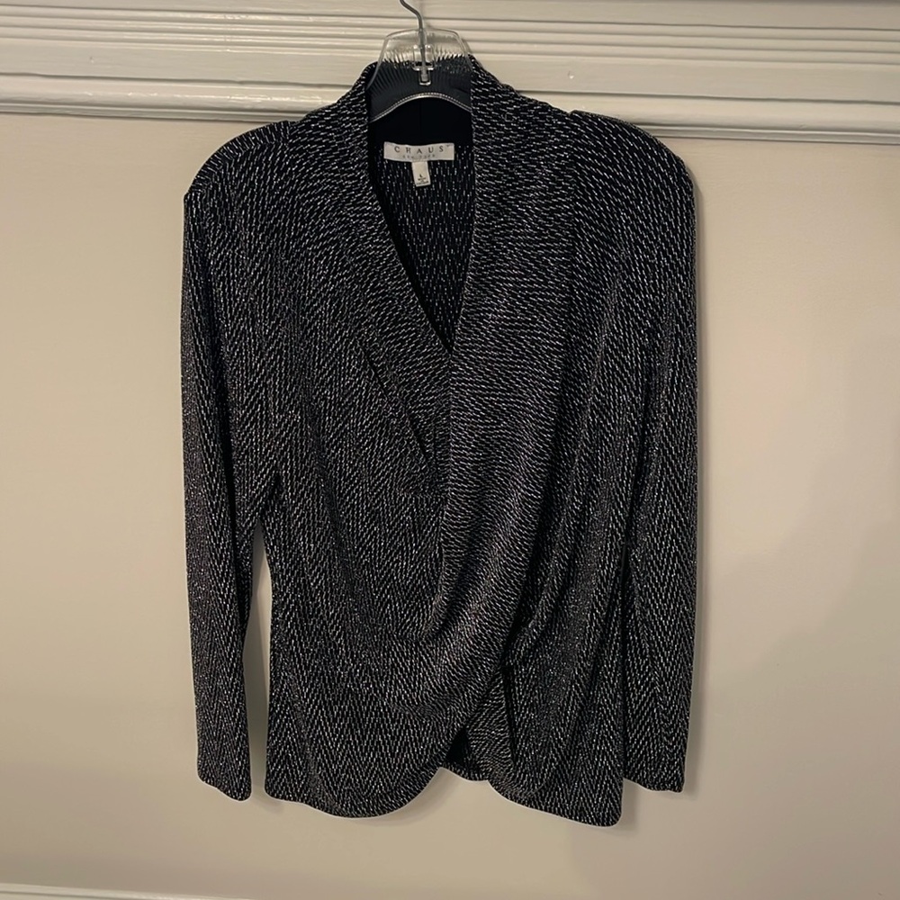 Beautiful black blouse with silver shimmers. V cut with crinkle.